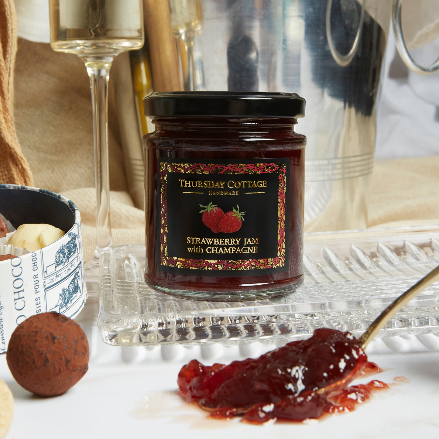 Close up of products in The Champagne Celebration Hamper, a luxury gift hamper from hampers.com UK