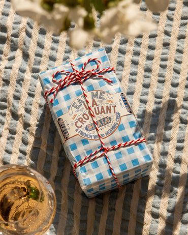 The Chocolate Gift Company La Croquant chocolate orange discs displayed on a blanket