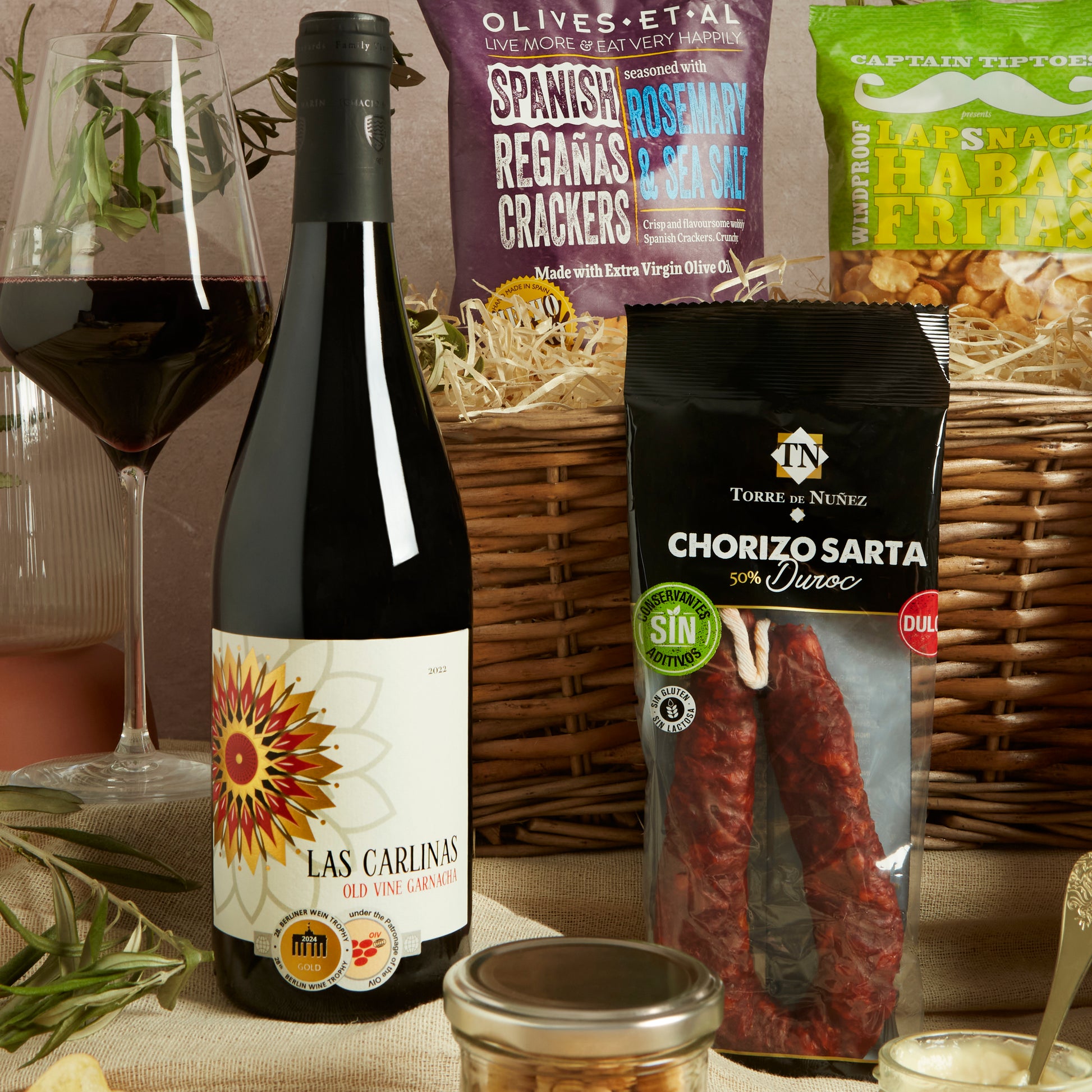 Close up of products in Spanish Tapas Food & Wine Hamper, a luxury gift hamper from hampers.com UK