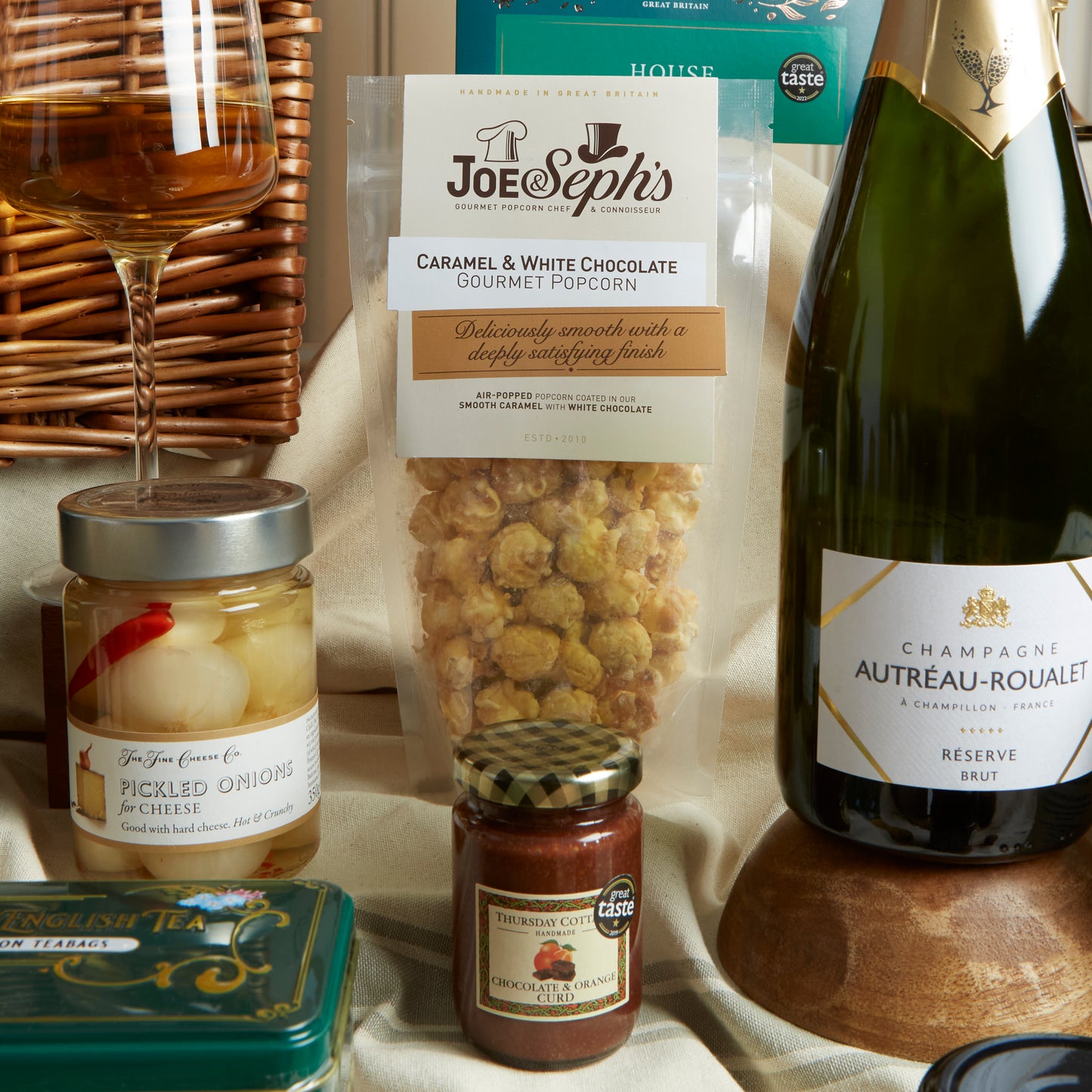 Close up of products in The Deluxe Food & Wine Gift Hamper, a luxury gift hamper from hampers.com