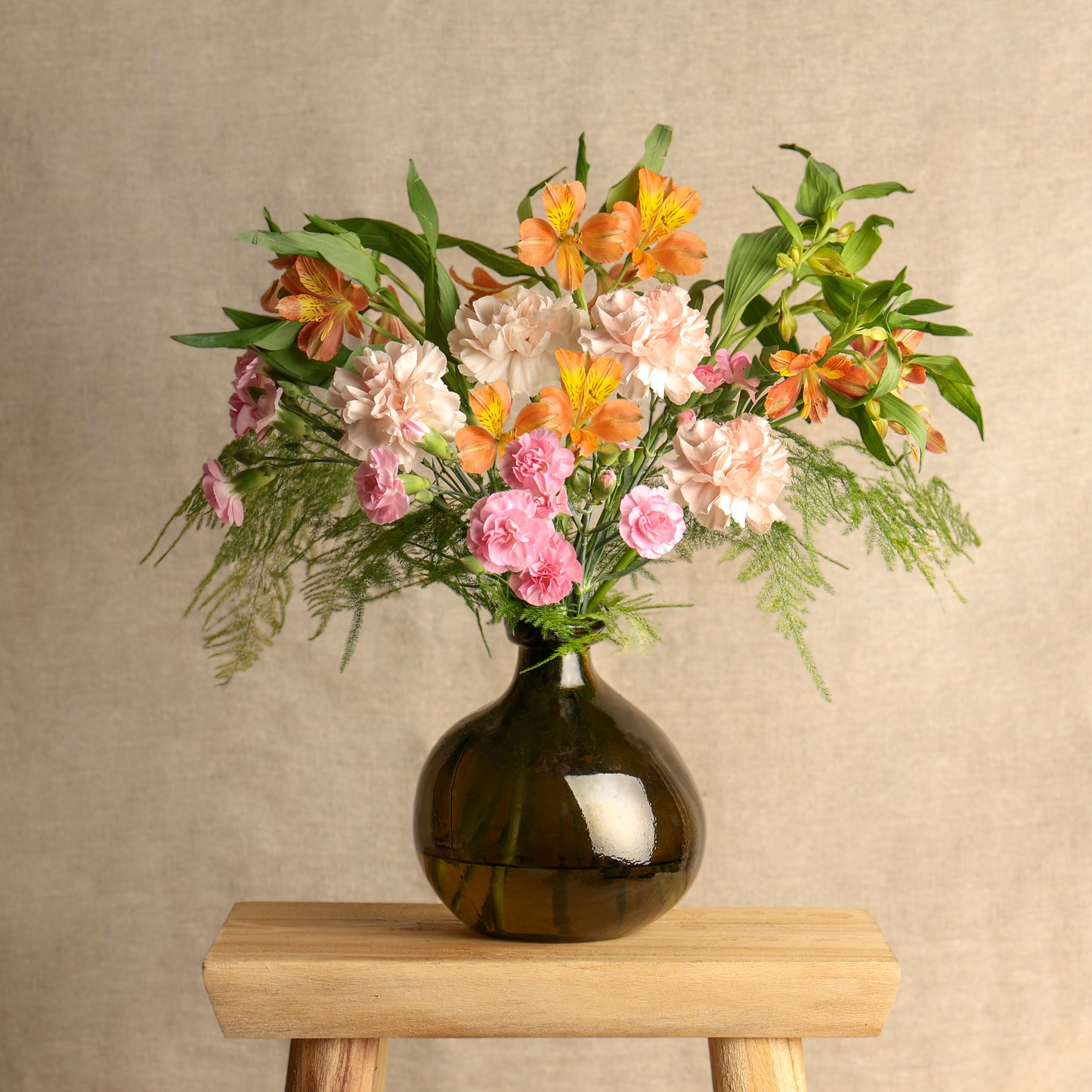 seasonal letterbox flower bouquet displayed in a vase after arranging the flowers