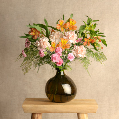 seasonal letterbox flower bouquet displayed in a vase after arranging the flowers