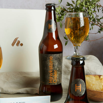Close up of products in The Hawkstone Cider Hamper, a luxury gift hamper from hampers.com UK