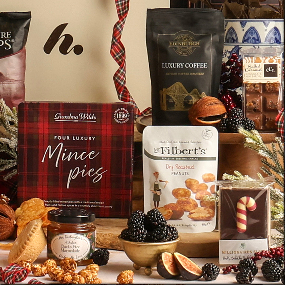 Bearing Gifts Christmas hamper contents, including dry roasted peanuts, mince pies, coffee and marmalade.