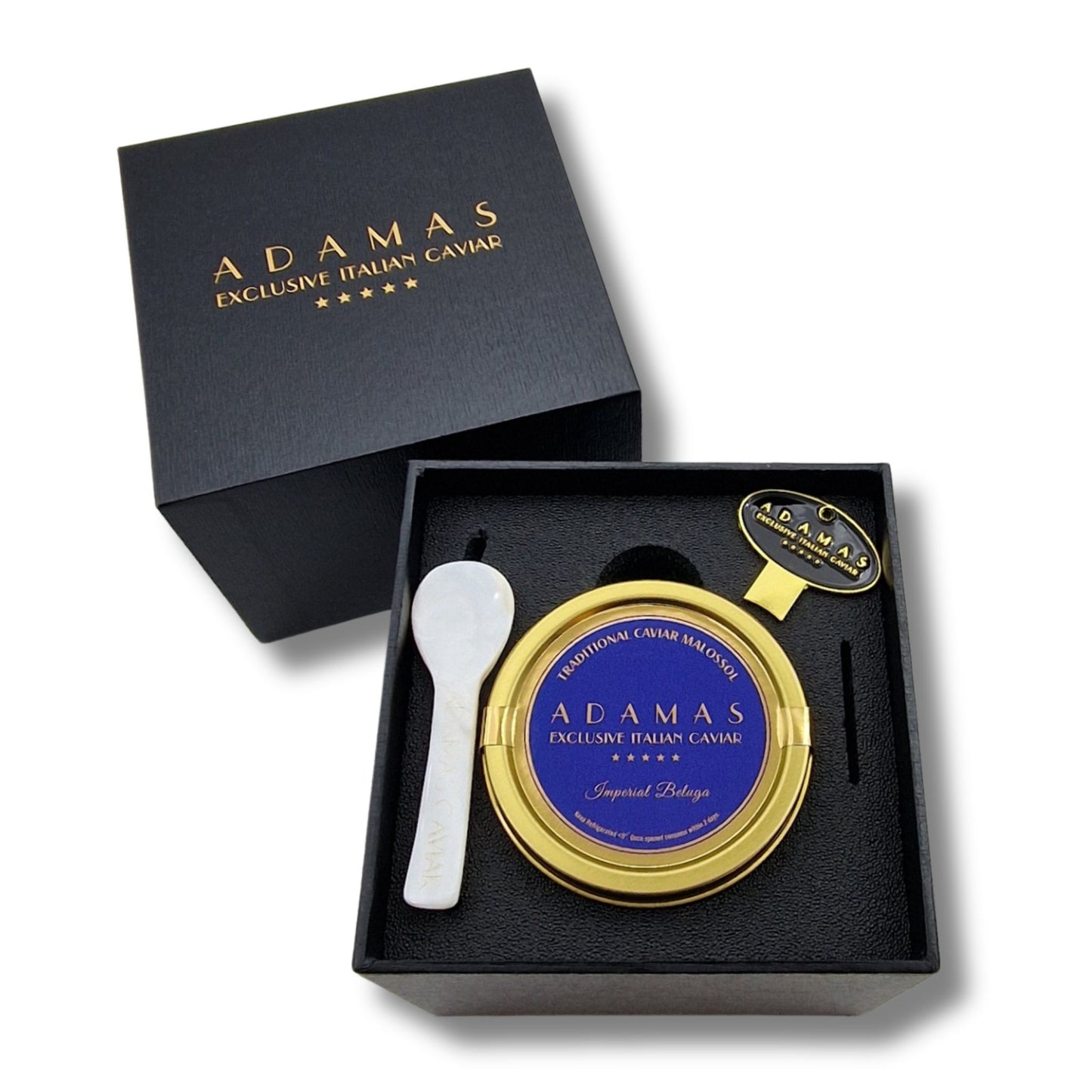 Adamas Italian Caviar Imperial Beluga gift set, featuring a round tin of blue label Beluga Caviar, a mother of pearl spoon, and a tin opener, presented in a black gift box.