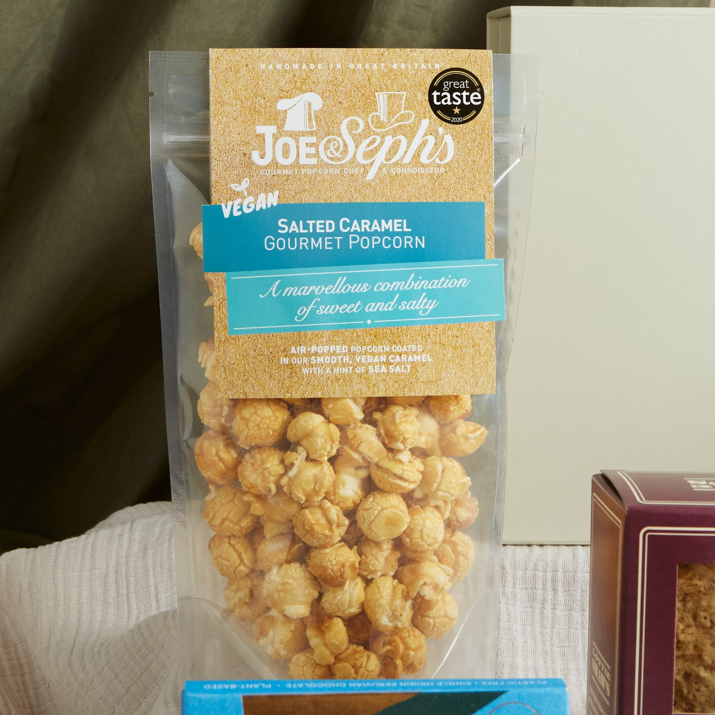 Close up of products in The Vegan Indulgence Hamper, a luxury gift hamper from hampers.com UK