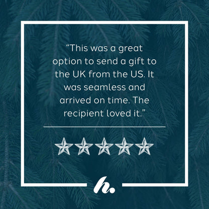 A five-star review graphic with a quote about sending a gift to the UK from the US, set against a dark teal pine tree background with a white border and logo at the bottom.