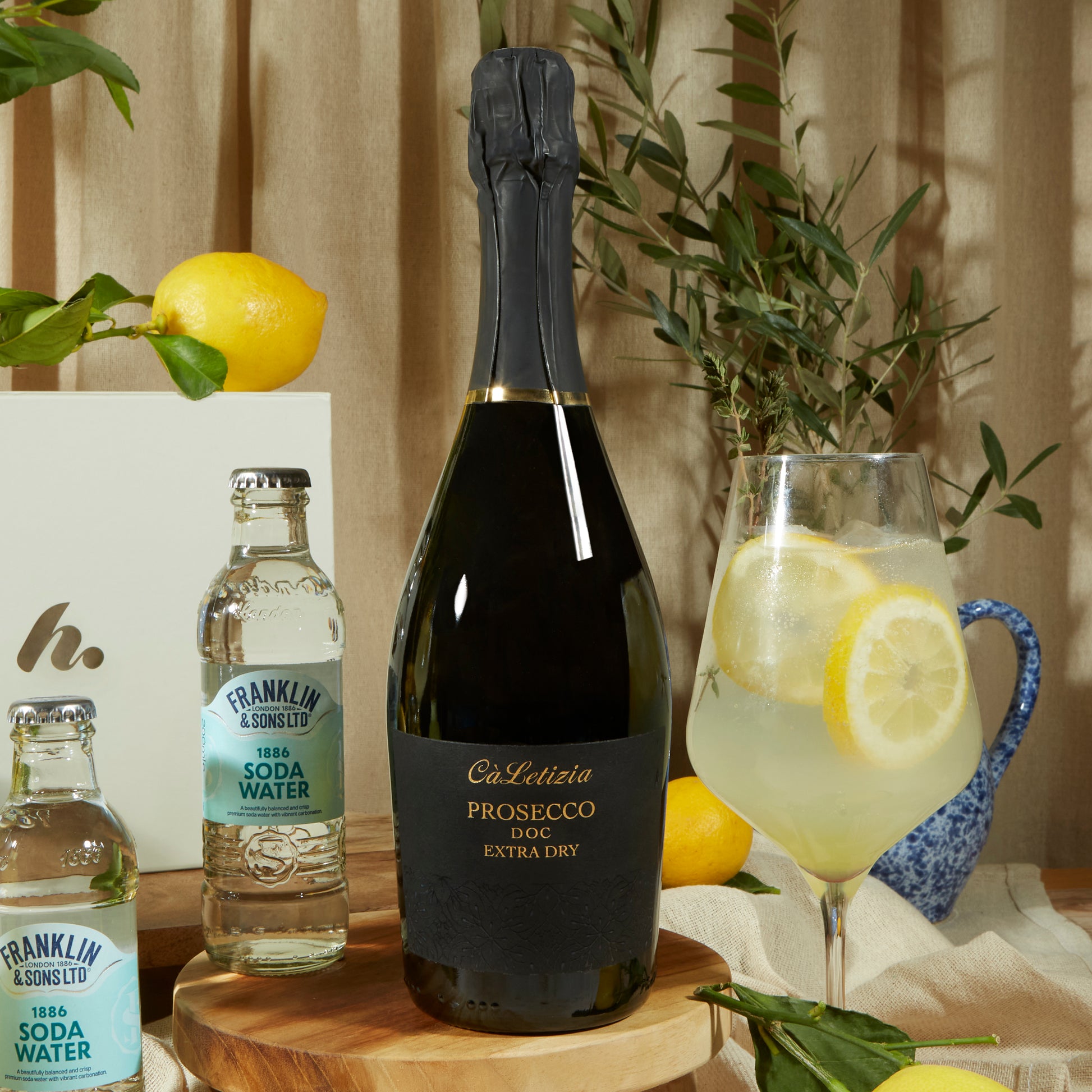 Close up of products in limoncello Spritz Gift Box, a luxury gift hamper from hampers.com UK