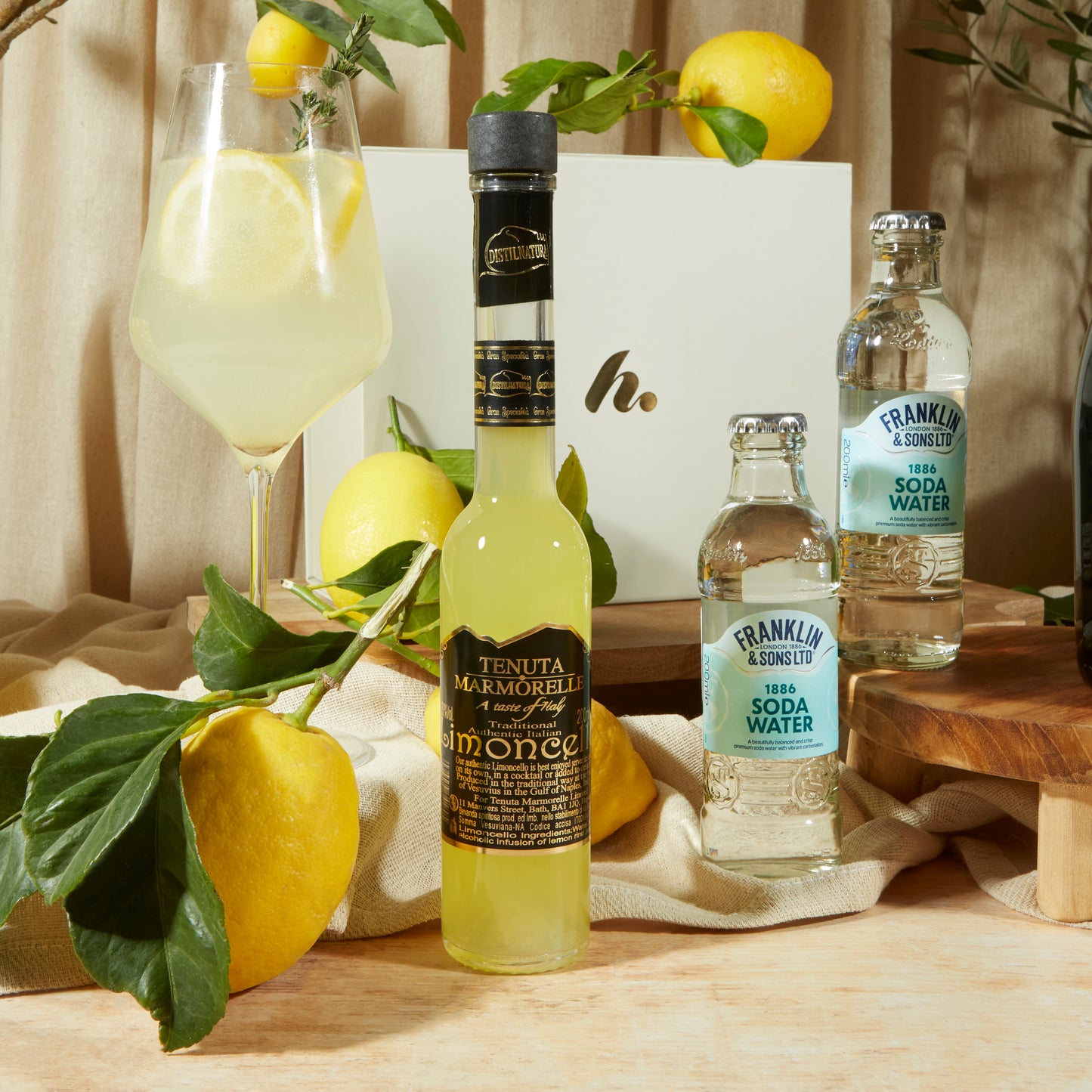 Close up of products in limoncello Spritz Gift Box, a luxury gift hamper from hampers.com UK