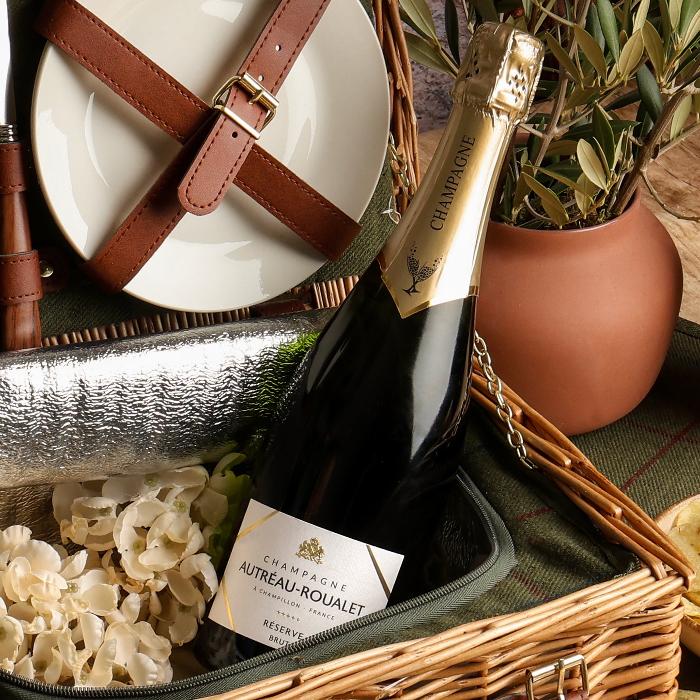 Close up of products in The Perfect Pairing Champagne Picnic Hamper, a luxury gift hamper from hampers.com UK