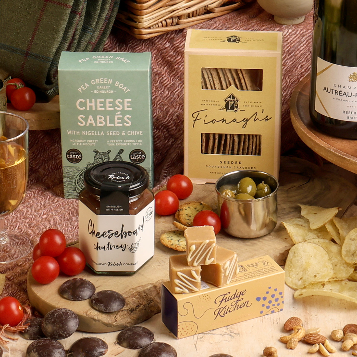 Close up of products in The Perfect Pairing Champagne Picnic Hamper, a luxury gift hamper from hampers.com UK