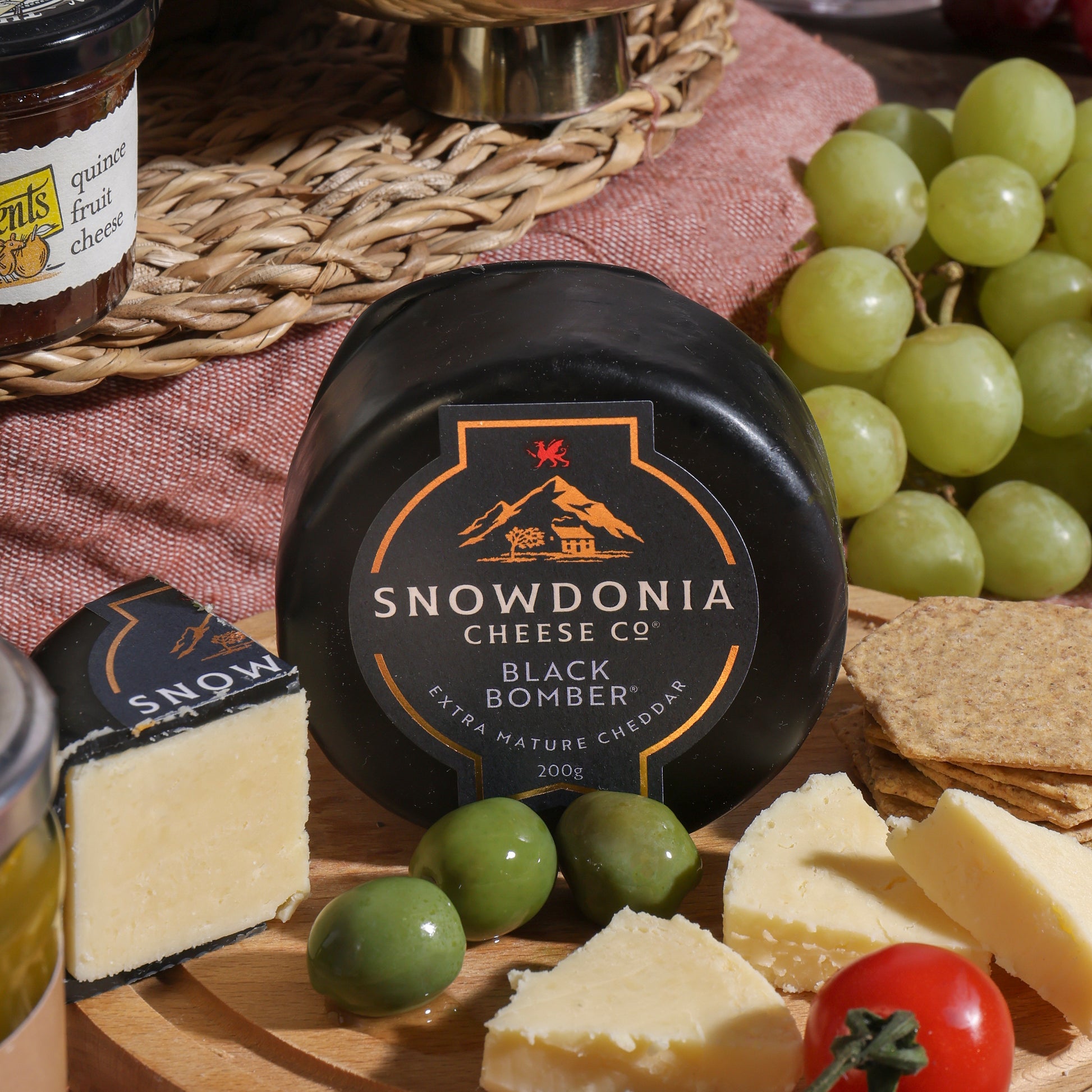 Close up of products in Luxury White Wine, Cheese & Quince Hamper, a luxury gift hamper from hampers.com UK