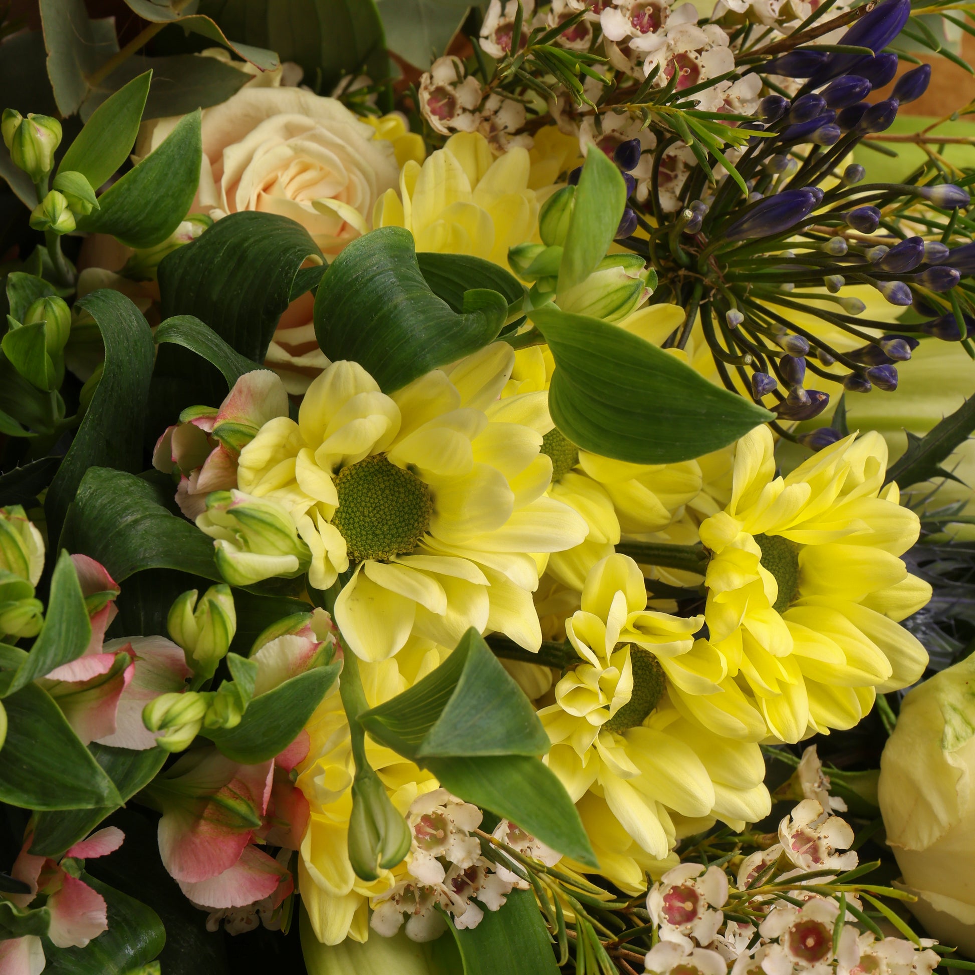 A close-up of the large seasonal flower bouquet, showing the fresh flowers in full bloom.
