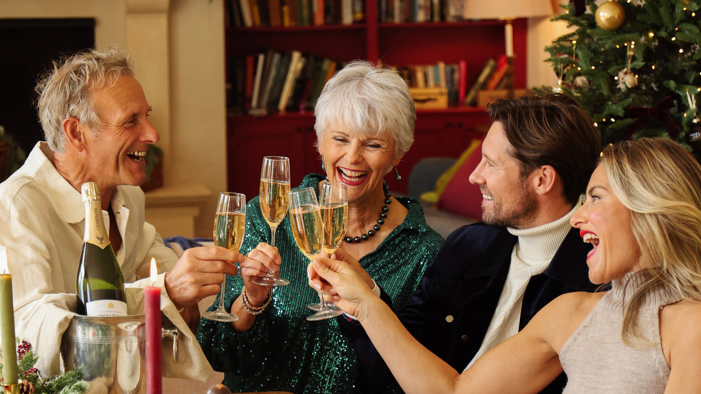 Group of people celebrating with champagne in a festive setting