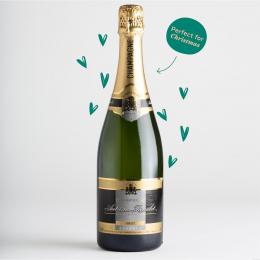 Bottle of Autreau Champagne surrounded by green hearts and a text stating 'perfect for Christmas'