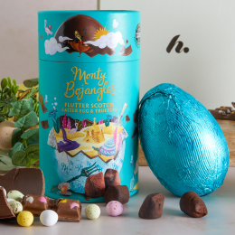 A picture of a chocolate Easter egg alongside miniature eggs and a chocolate bar