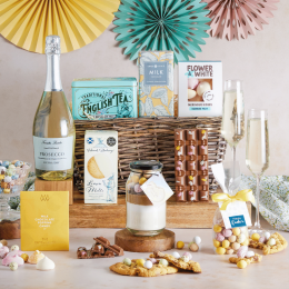   Easter Family Sharing Hamper with Prosecco with contents on display and Spring decorations
