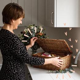 Lady opening a gorgeous hamper