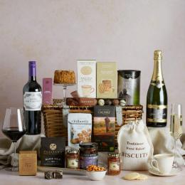 The Prestige Food and Wine Hamper with contents on display including Champagne and red wine for the perfect luxury retirement gift