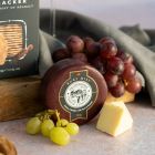Close up of products in Classic Red Wine & Cheese Gift Box, a luxury gift hamper at hampers.com