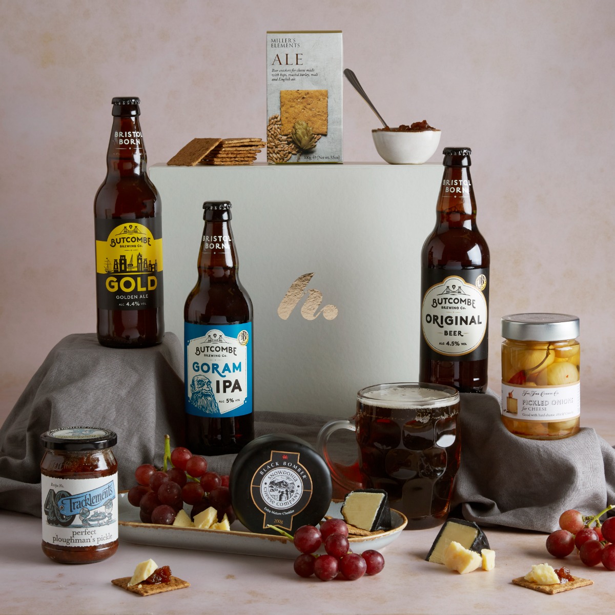 Ploughman's Beer & Cheese Hamper with contents on display, including real ales