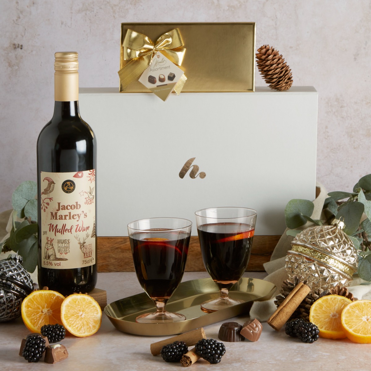 Festive Mulled Wine and Chocolate hampers with contents on display - the perfect Christmas gift for grandad