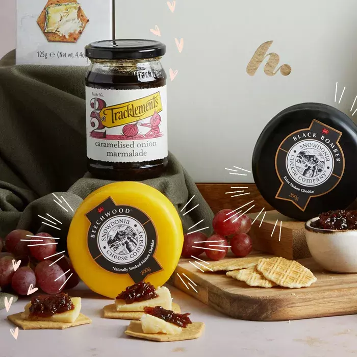 A selection of cheeses, biscuits and chutney
