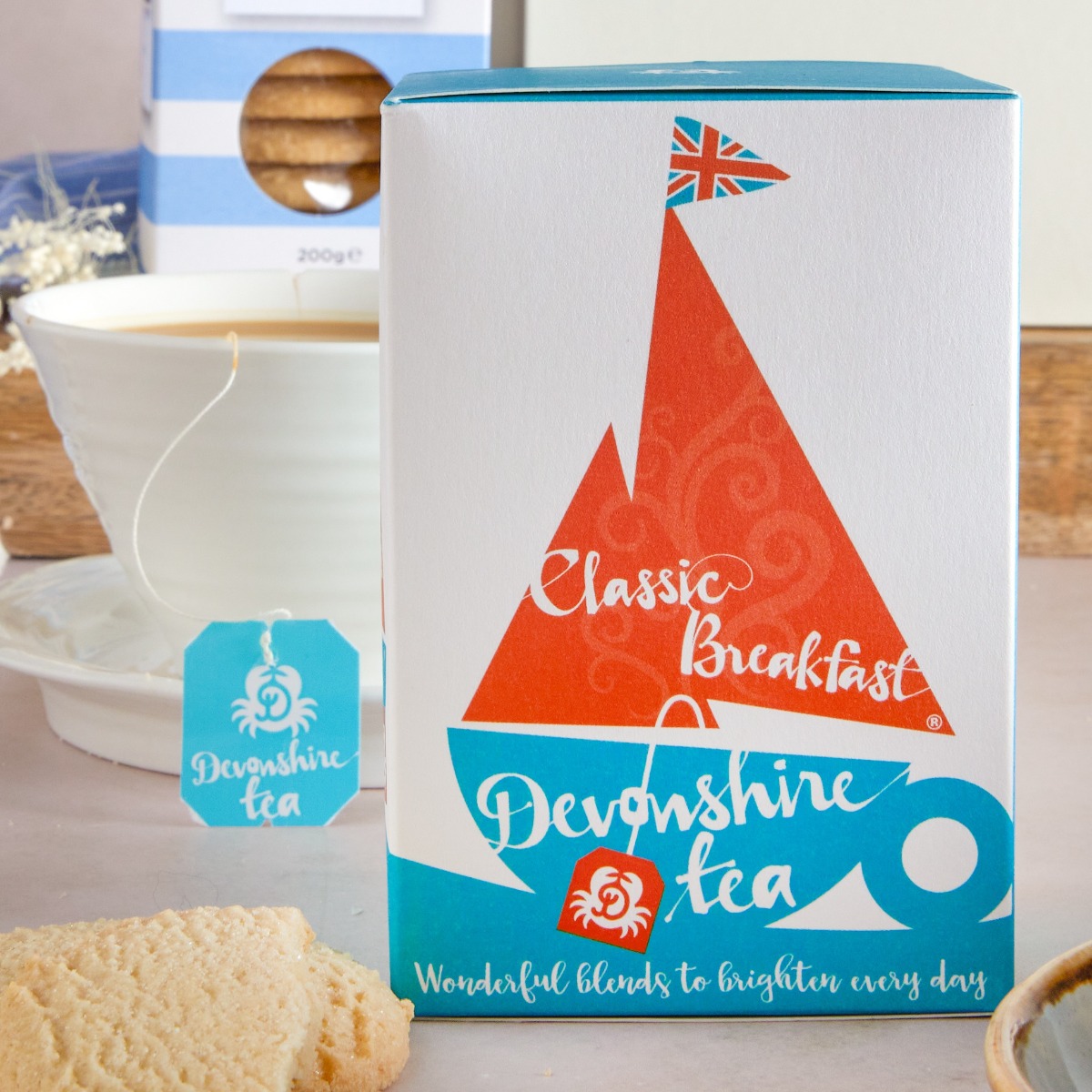 Devonshire Tea box of tea with cup in the background