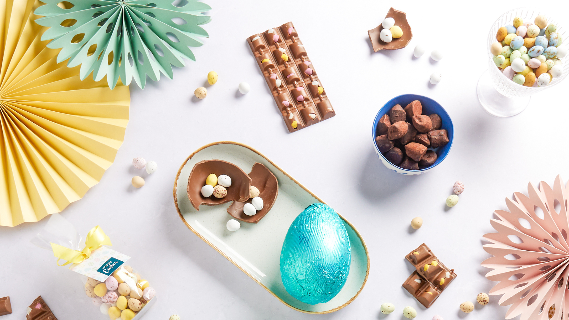Flat lay of a range of Easter chocolate products including chocolate eggs