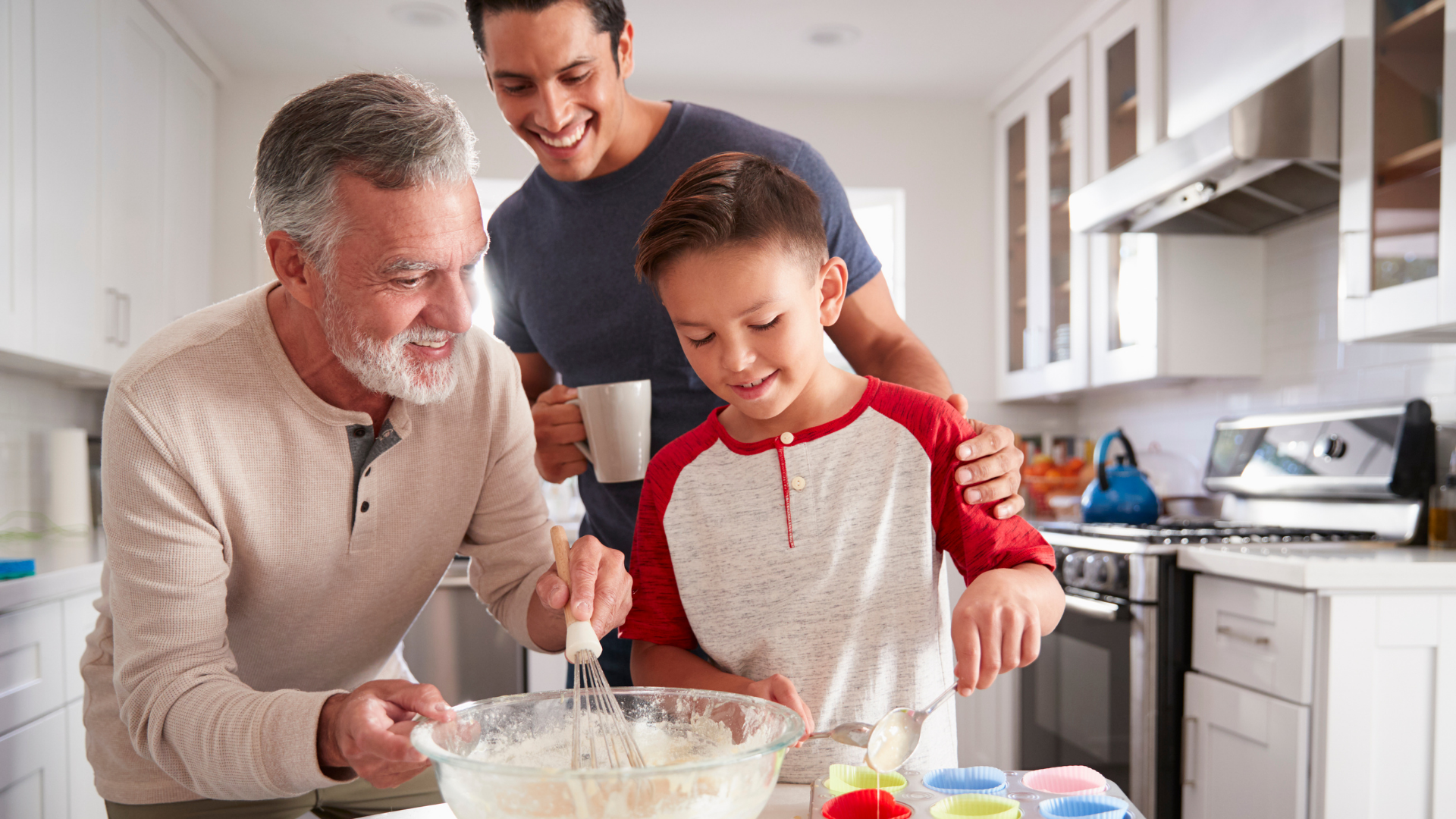 Father, son and grandad cooking together for Father's Day