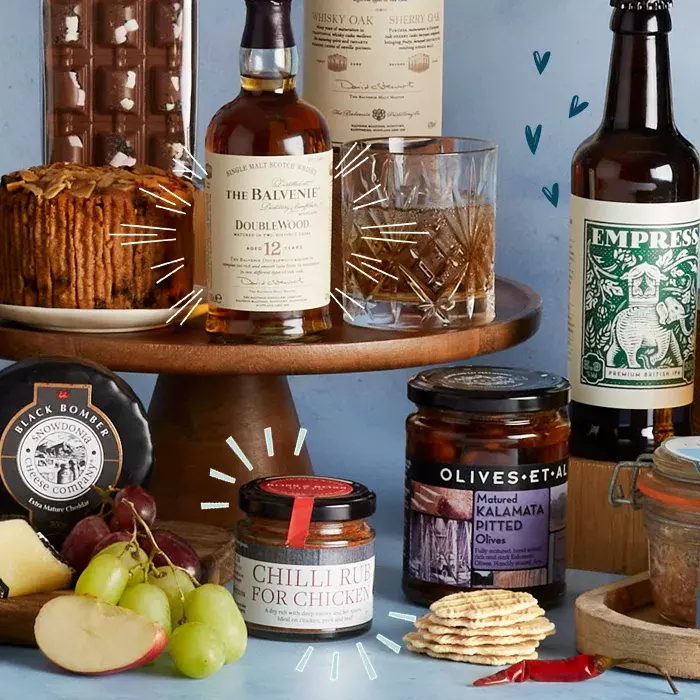 A Father's Day hamper featuring cheese, beer whisky and other foods