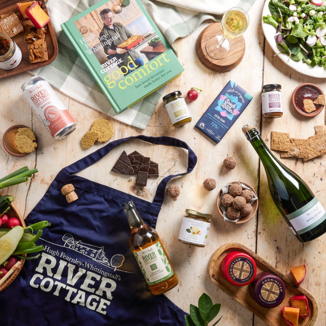 Flat lay of River Cottage Hamper with cider bottle in the middle