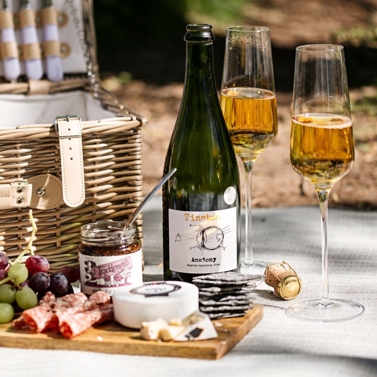 A Picnic Hamper with a bottle and glasses