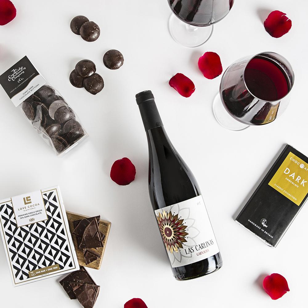 A photo of wine, chocolate and other romantic gifts