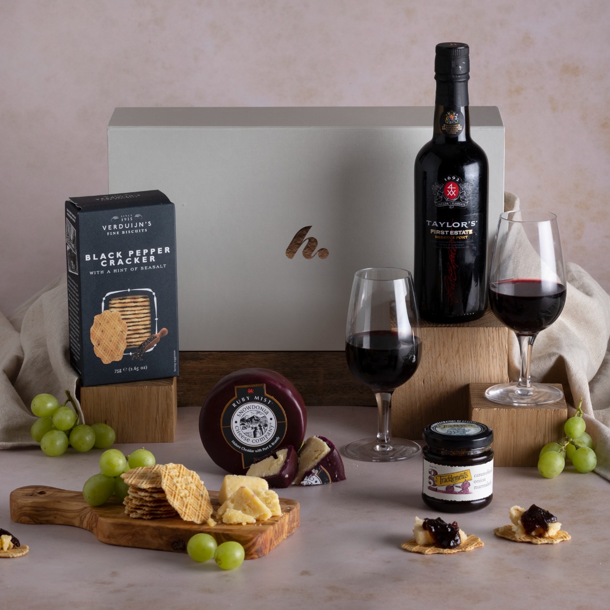 Classic Port and Cheese Hamper with content and a glass of port on display