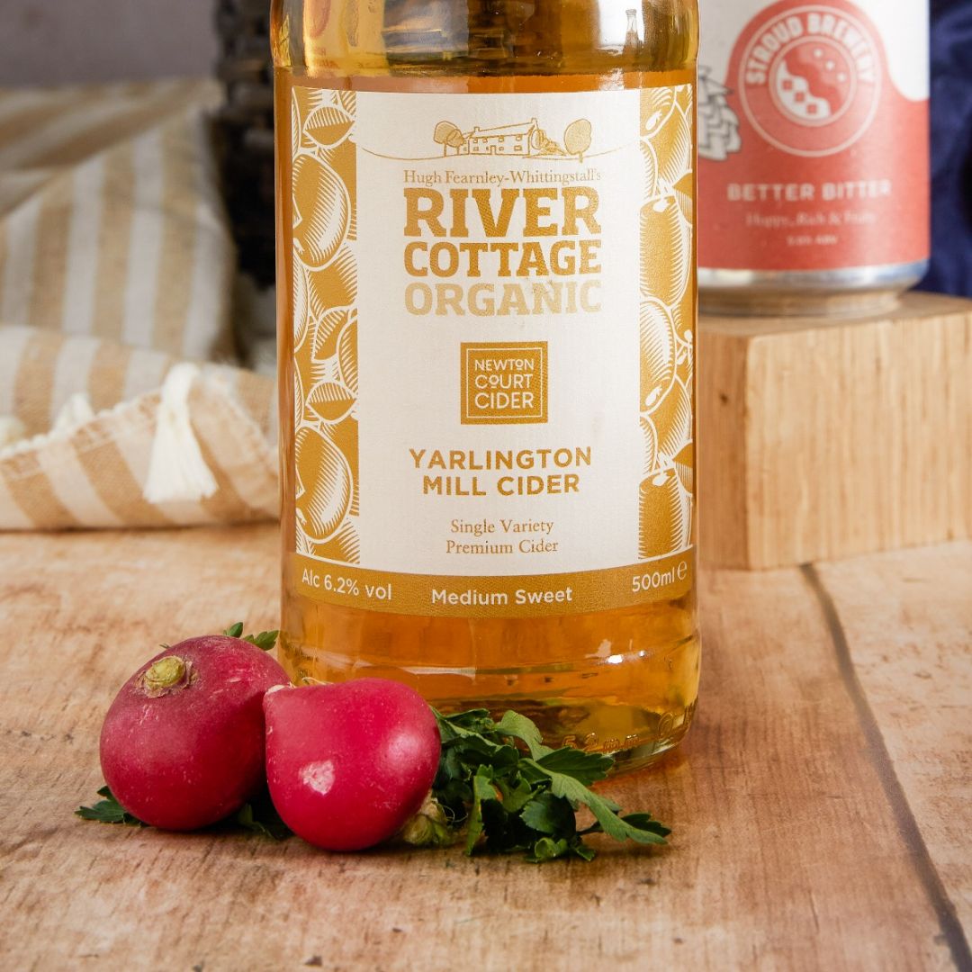 A close up of River Cottage Organic Yarlington Mill Cider by Newton Court Cider