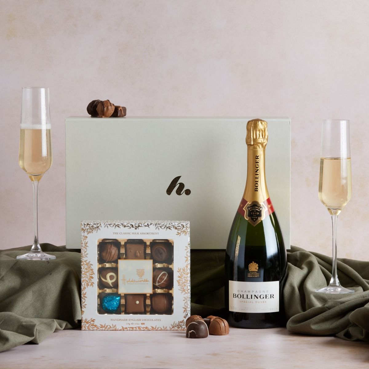 Bollinger Champagne & Chocolates gift box with flutes and contents on display