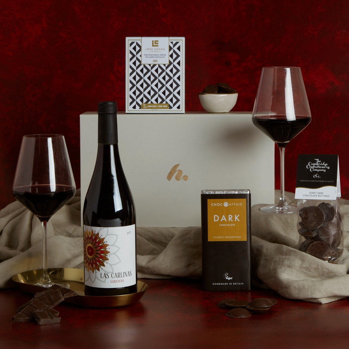 Valentine's Red Wine & Dark Chocolate gift hamper with contents on display and signature h box