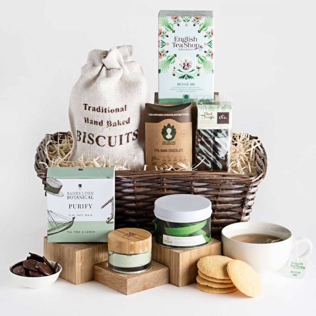The contents of the relax and wellbeing hamper with wicker gift basket