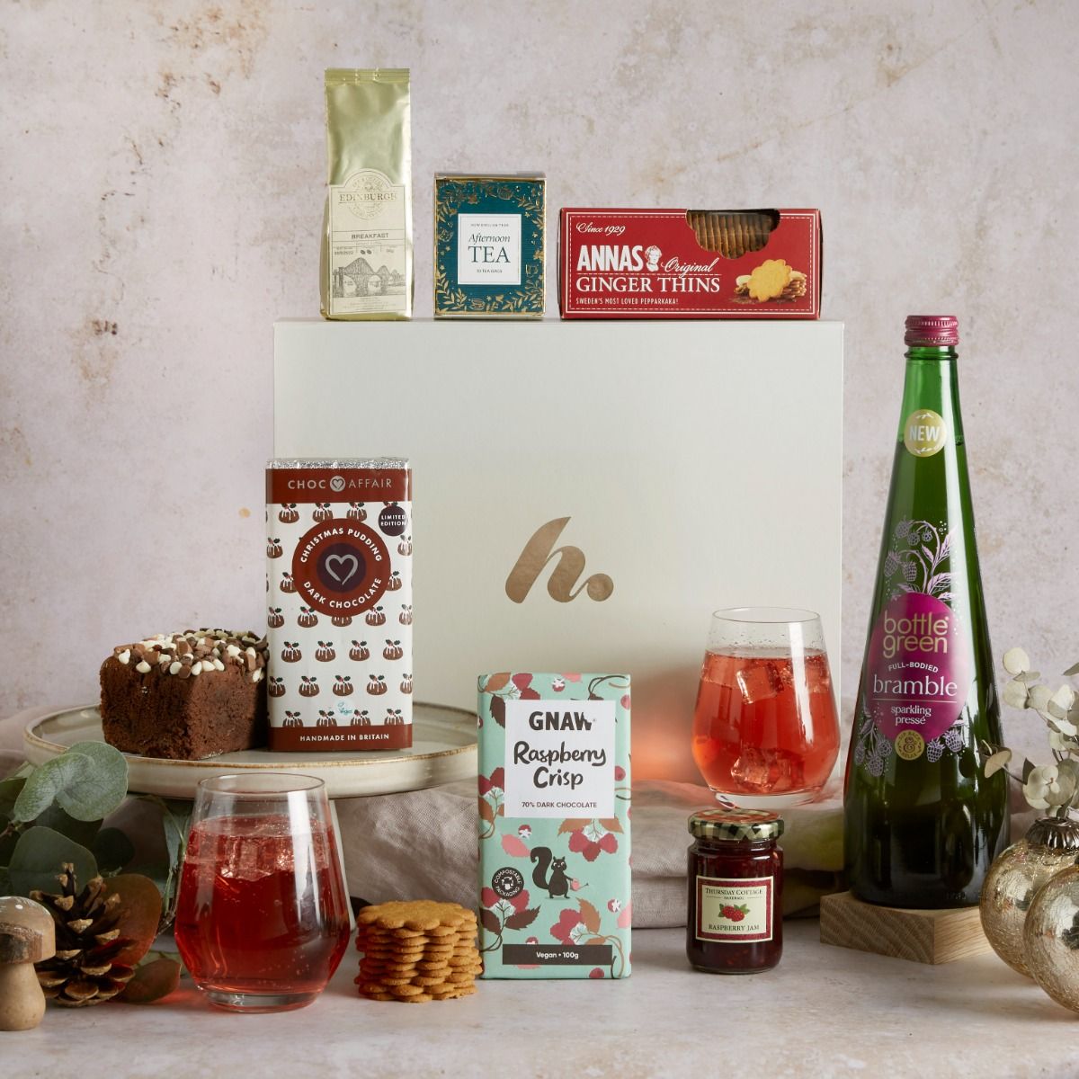 The Christmas alcohol free favourites hamper with contents on display and signature gift box