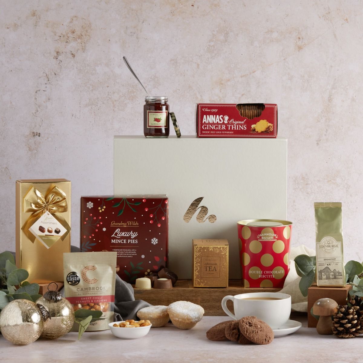 The Christmas Delights Hamper with contents on display and signature gift box