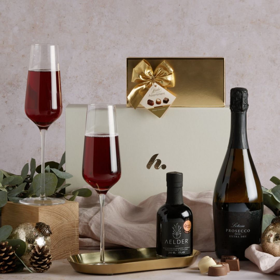 Christmas prosecco cocktail hamper with glasses full of the Aelder Elixir and Prosecco cocktail