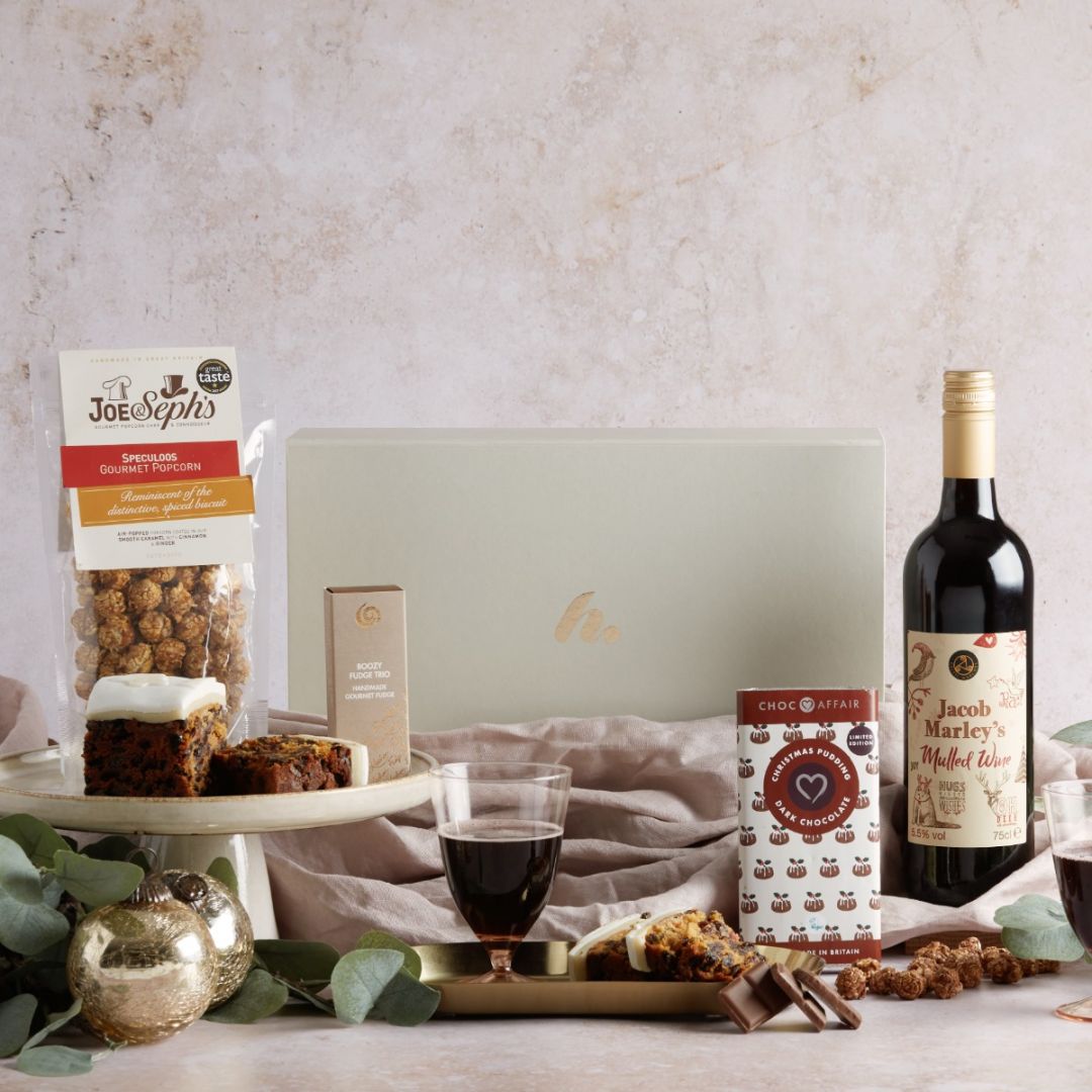 Festive Gluten Free Hamper with contents on display and signature cream gift box