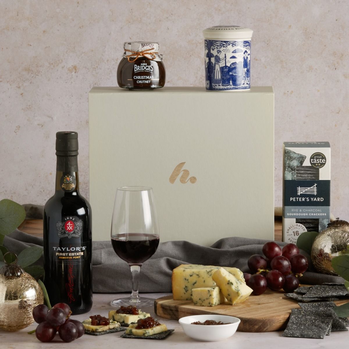 The Port & Stilton Christmas Gift Box with the contents on display, including ceramic pot of stilton and a signature cream gift box