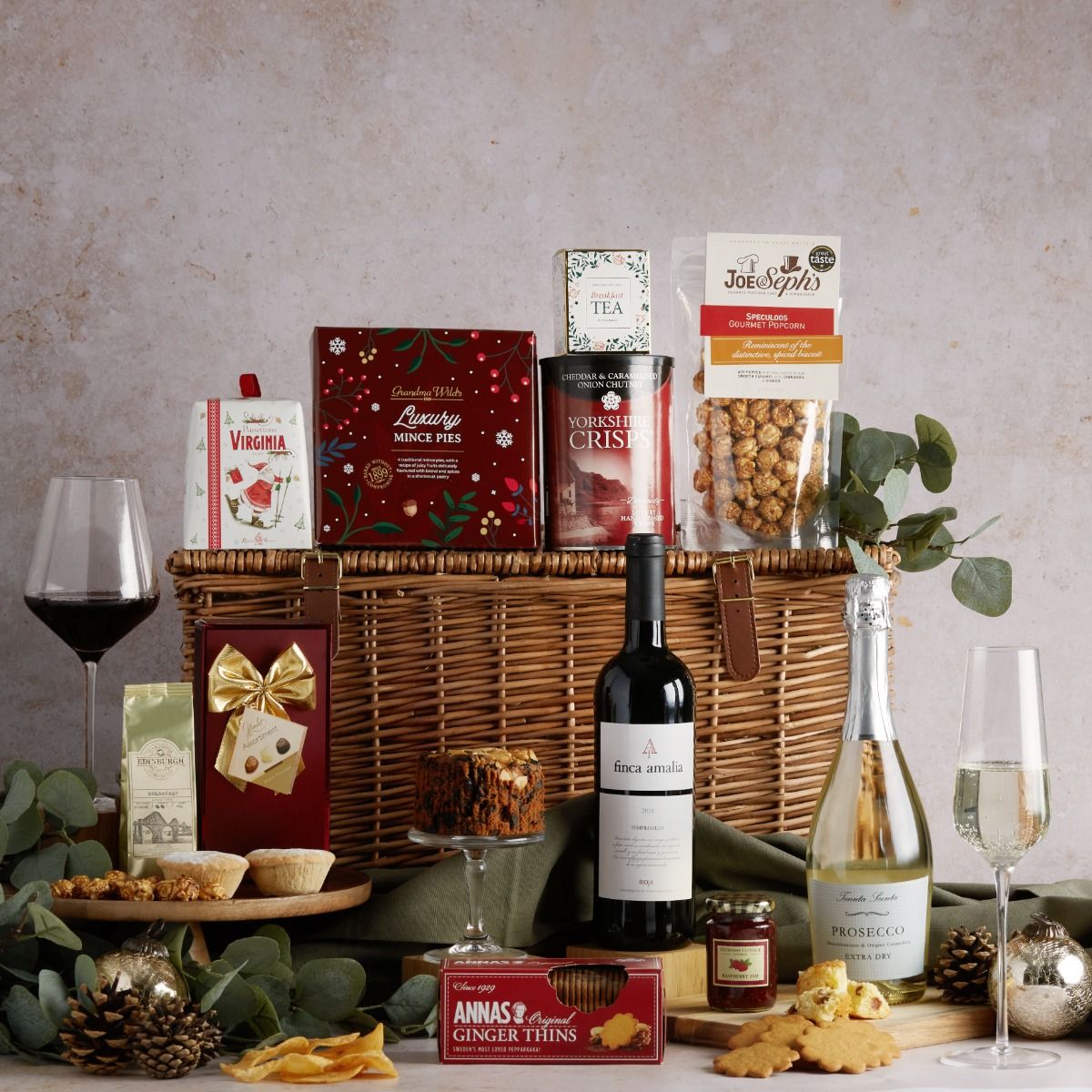 Luxury Bearing Gifts Hamper with contents on display with its wicker basket