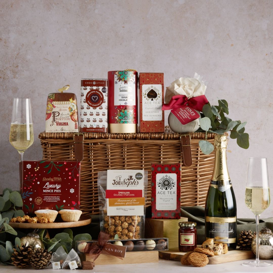 The Traditional Luxury Christmas Hamper and its contents on display with wicker basket