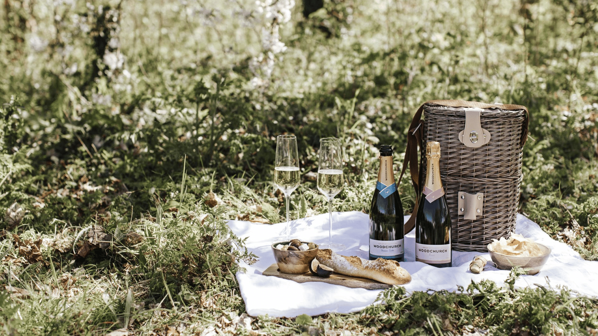 English Sparkling Wine Hamper and bread on display as a picnic