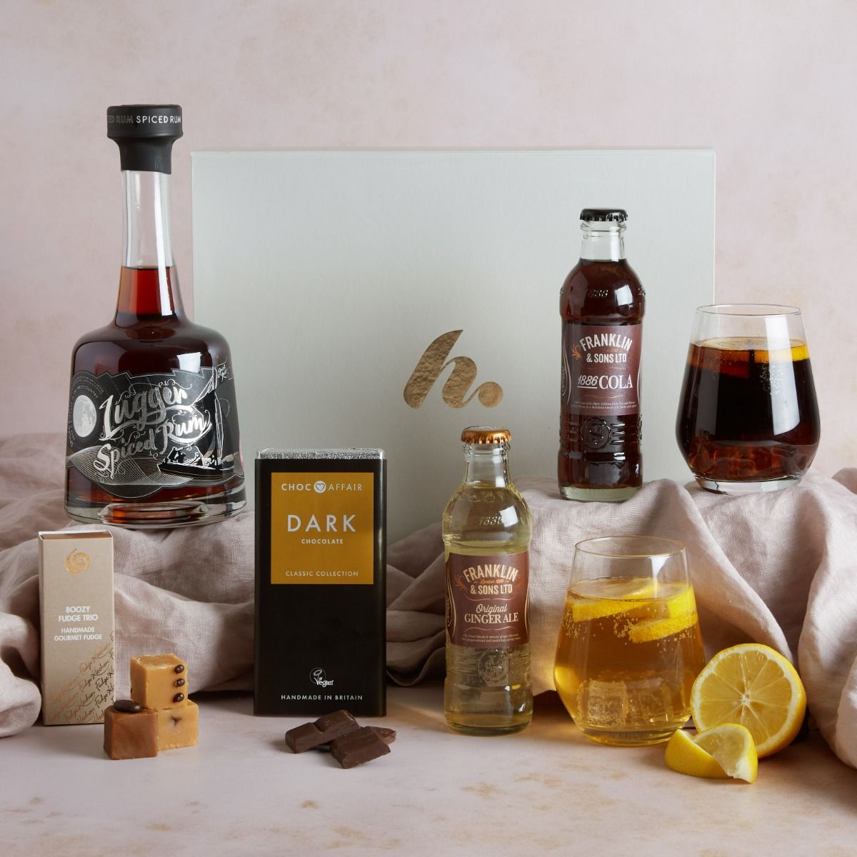 The Spiced Rum and Dark Chocolate Hamper with contents on display