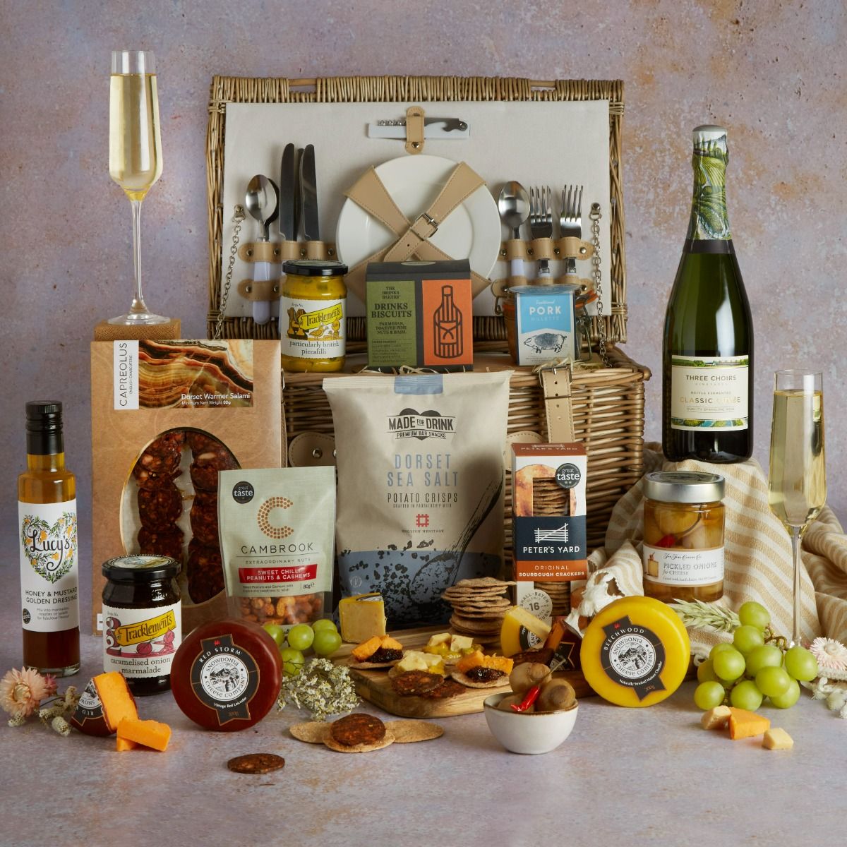 Best of British Picnic Hamper for Four with picnic basket open and food and drink contents on display