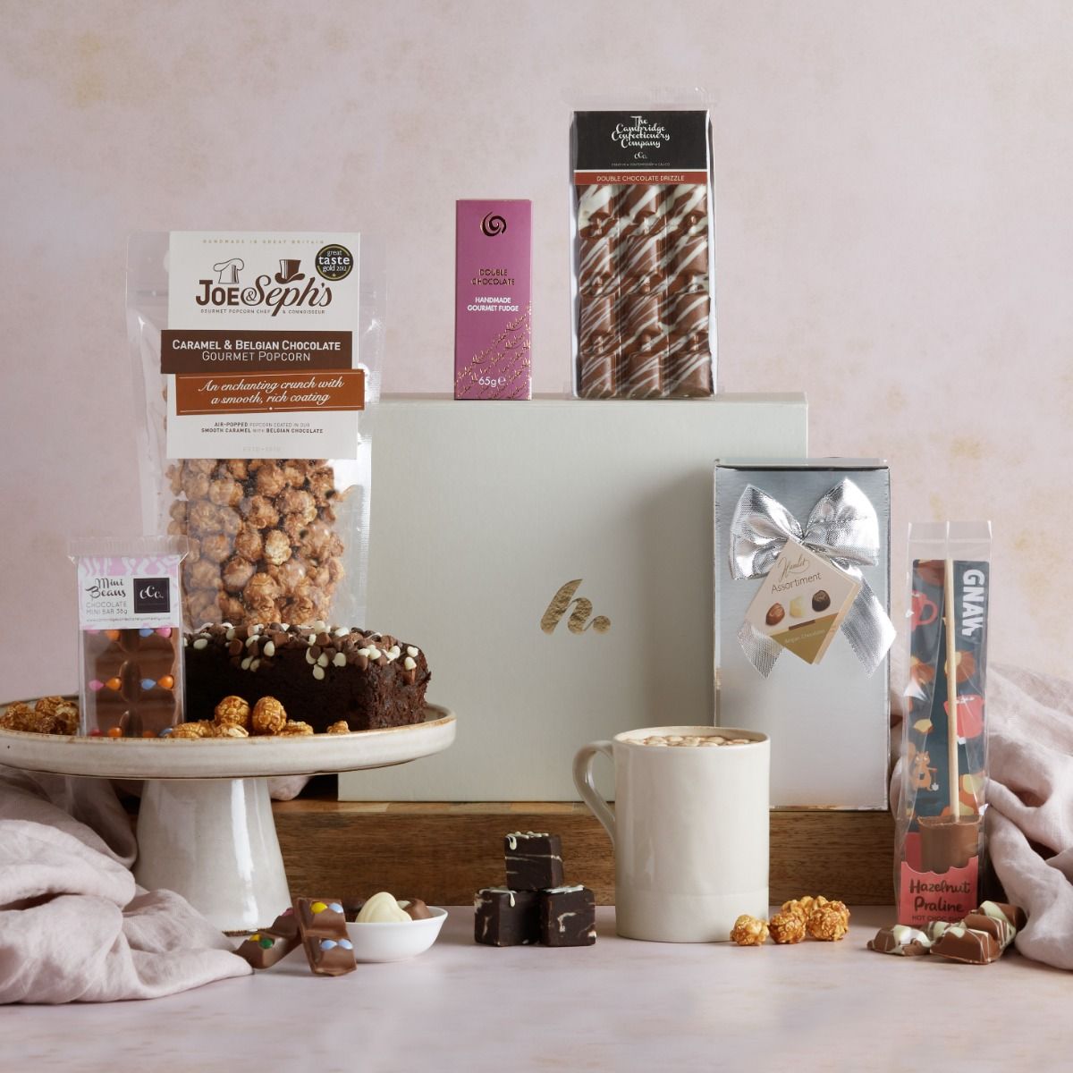 The Gourmet Chocolate Lovers Hamper with contents on display and signature gift box